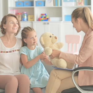 mom and child talking with a SPED teacher as child is anxious to go back to school